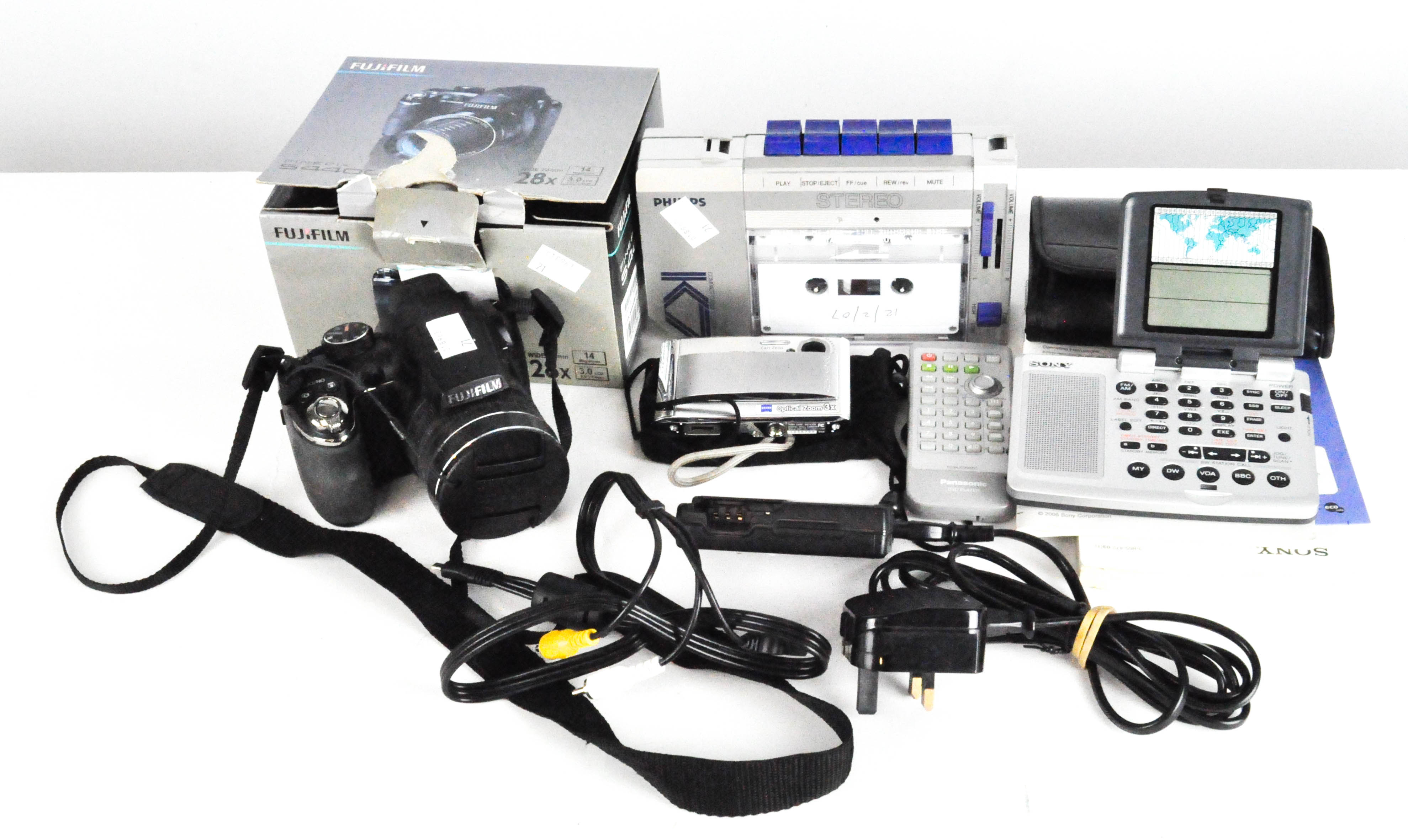 A Fujifilm s4400 digital camera together with a Philips compact cassette player and other items