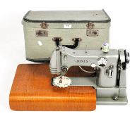 A vintage Jones 283 F light green enamelled sewing machine in a green case