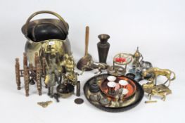 A collection of brass and copper items including horses, a small pair of Tibetan symbols, chargers,