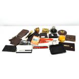 A selection of pens and leather cigar cases, together with metal bangles and more