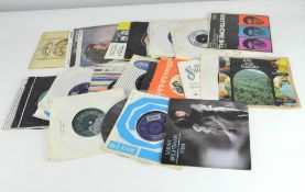 A quantity of vintage 45's LP's, featuring an assortment of pop and classical music,