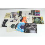 A quantity of vintage 45's LP's, featuring an assortment of pop and classical music,