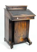 A small late 19th century mahogany davenport/bureau with pen and paper storage under a narrow lid