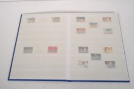 A collection of World stamps in seven albums and loose;