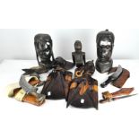 A parcel of African wooden tribal carvings, together with a selection of knives