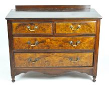 An early 20th century galleried mahogany chest with two small drawers over two larger,