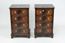 A pair of reproduction four drawer chests with ring handles,