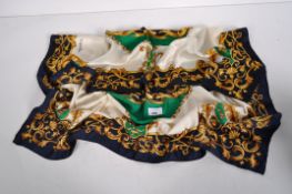 A Viyella silk scarf with blue border and a central green cartouche,