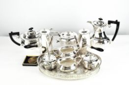 A quantity of silver plate, including a Yeoman four piece tea set, three piece tea set, cake knife,