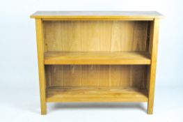 A modern oak bookcase with two shelves,