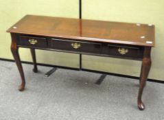 A modern console/hall table with the central drawer flanked by two false drawer fronts,