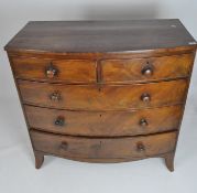 An early 19th century mahogany bow front chest of drawers,