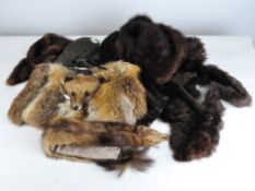 A selection of vintage furs, including a pelt, fox fur bag,