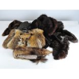 A selection of vintage furs, including a pelt, fox fur bag,