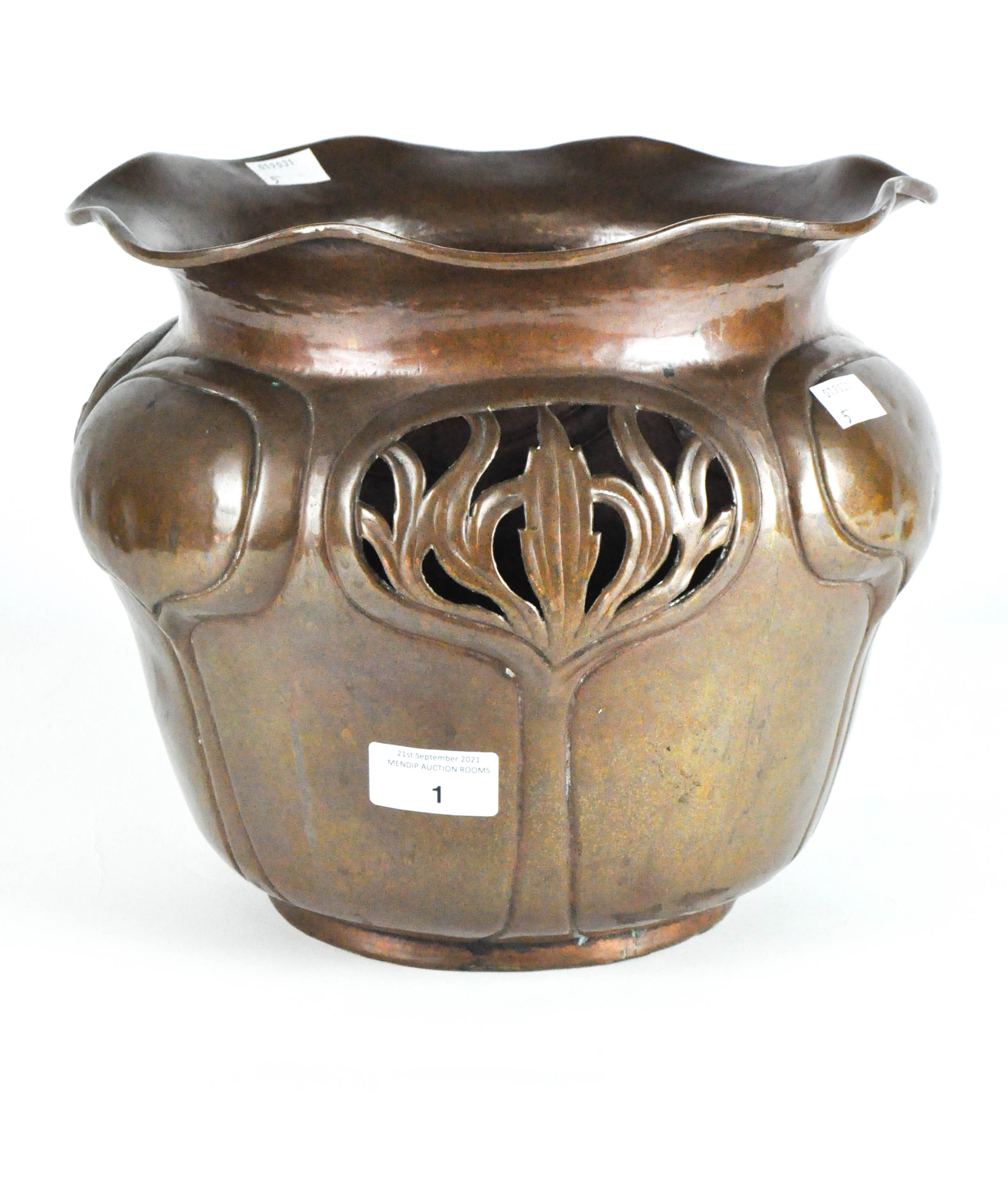 An early 20th century Art Nouveau copper jardiniere, adorned with pierced and embossed detailing,