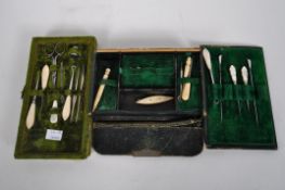 A selection of bone, mother of pearl and ivory sewing implements, including crochet hooks,