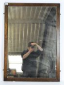 A heavy rectangular mahogany framed wall mirror 107cm x 76cm