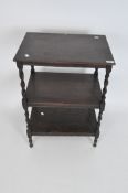 An oak what-not, early 20th century, with two tiers on barley twist supports,