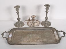 A silver plated oblong tray with handles and engraved decoration,