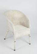 A white painted Lloyd Loom chair with gold painted details,