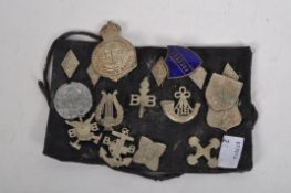 A collection of 1940's Brigade badges and an arm band