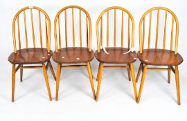 A set of four Ercol spindle back kitchen chairs in beech and elm,