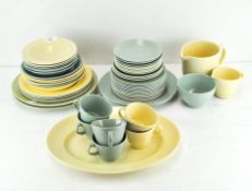 A Woods pottery green ground and pale yellow ground part dinner and tea service including tea cups