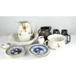 A ceramic toilet set, comprising a jug, wash bowl, vase, lidded pot and bedpan, and other items
