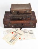 A vintage leather bound trunk, initialled J.K.H.R, together with two smaller cases