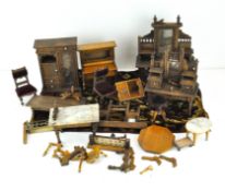 A collection of wooden dolls house furniture, mostly oak and pine, including wardrobes,