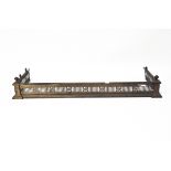 A Victorian brass fireplace fender, with pierced and moulded decoration