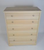A contemporary five drawer chest,