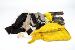 A collection of vintage linen including a child's yellow dress and more