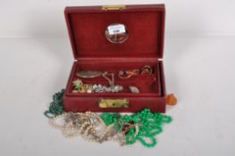 A jewellery box and contents of costume jewellery,