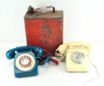 Two vintage telephones in petrol blue and cream, together with a red painted oil can,