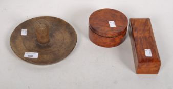 A sycamore treen stand, together with two wooden lidded boxes of rectangular and circular form