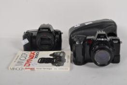 A Canon EOS 1000F camera, together with a Minolta Dynax 7000i AB-700,