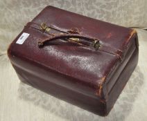 A 19th century Gladstone red leather bag with watered silk interior