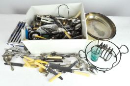 A collection of silver plate, including flatware, toast rack, dishes,