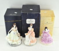 Three limited edition Coalport figures of ladies in pastel coloured dresses,
