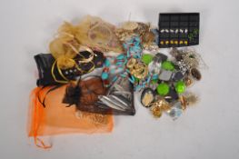 A quantity of costume jewellery, including enamelled earrings, paste and simulated cameo brooches,