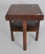 An Art Deco period walnut veneered occasional table, of square section with lower tier,