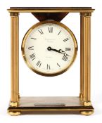 A Garrard & Co gilt brass portico style mantel clock, with a 3 1/4" dial,