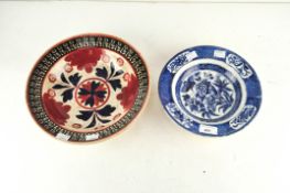 Two 19th Century ceramic bowls, one with blue and white printed floral decoration,