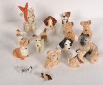 A quantity of Sylvac dog ornaments, featuring a variety of breeds,