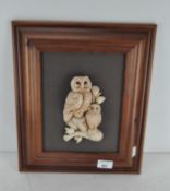 A contemporary three-dimensional owl sculpture mounted on board, framed,
