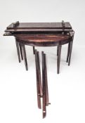 A Georgian mahogany oval extending dining table on square supports