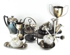 A collection of silver plate including trophies, a coffee pot, napkin rings, trays,