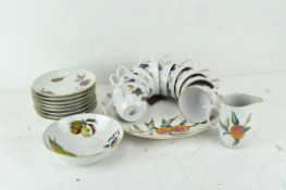 A Royal Worcester 'Evesham' pattern tea service, comprising cups, saucers, bowl, plate and more