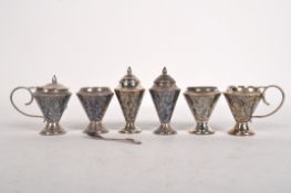 A collection of niello decorated cruet items, stamped Sterling 925,